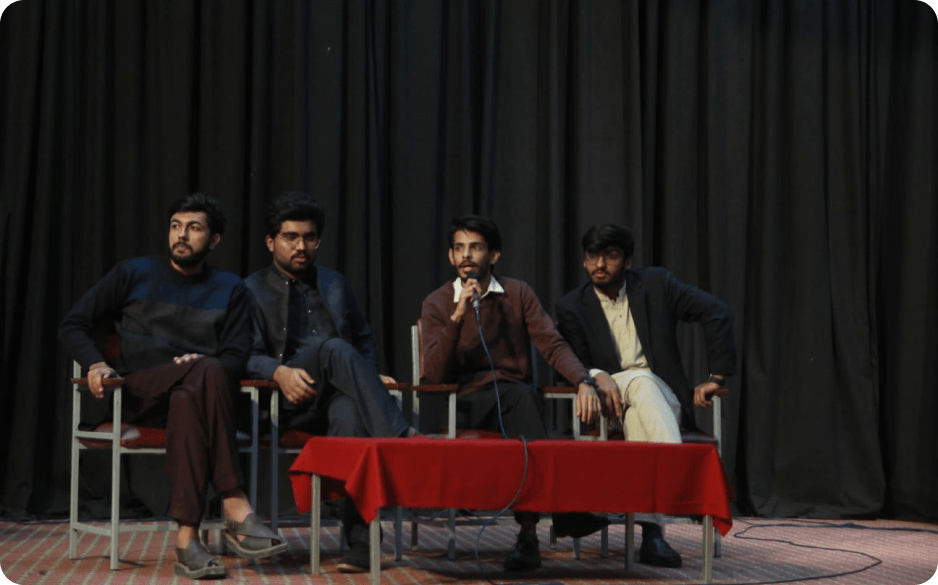 Abdullah at a literary event on stage